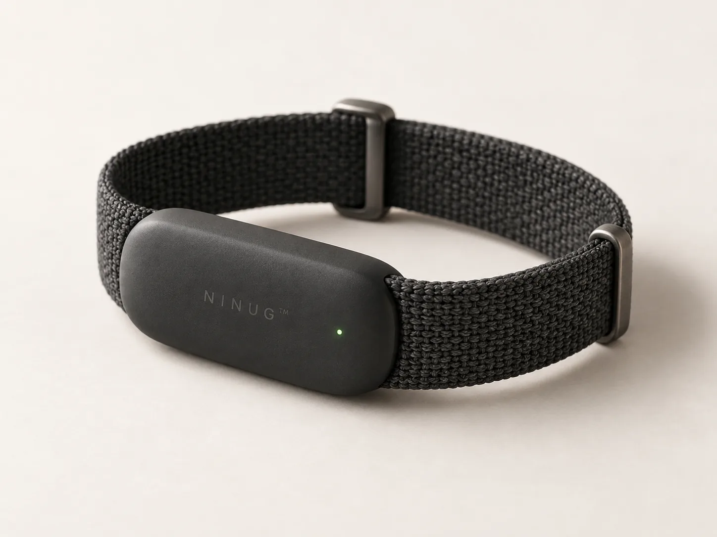 The Ninug Band, a screenless fitness band with a knitted charcoal strap